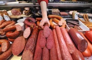 A saleswoman rearranges a display of Ger